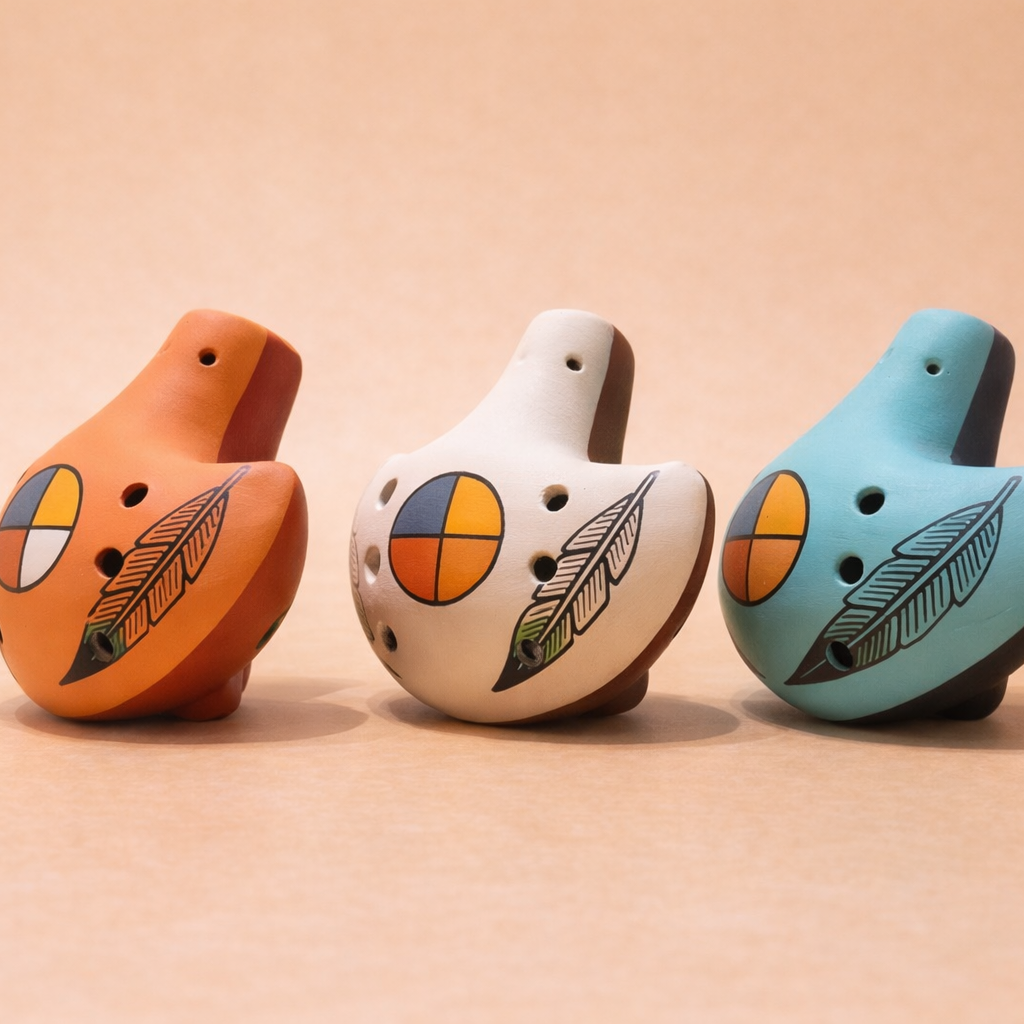 Ceramic ocarina flutes in terracotta, sandstone, and turquoise colors