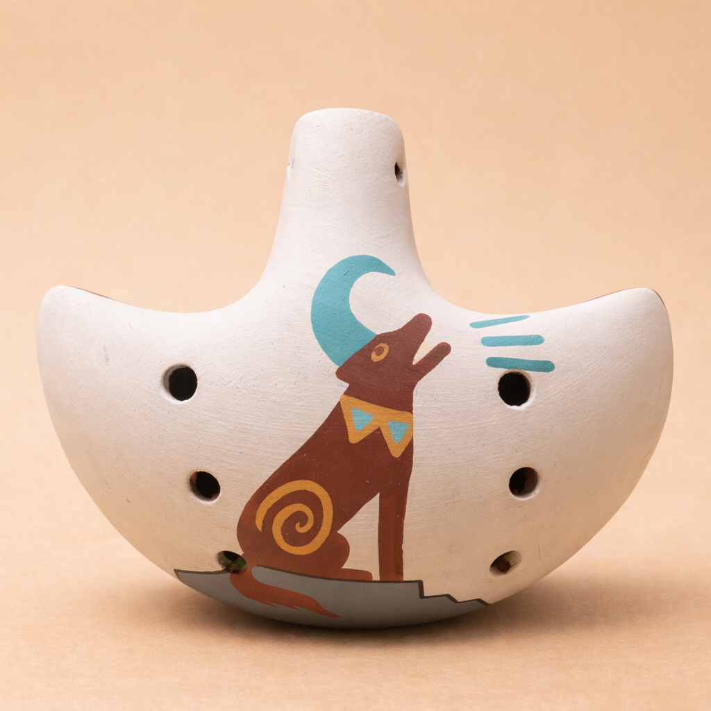 Hand-painted ceramic ocarina flute with coyote howling at moon design in sandstone color